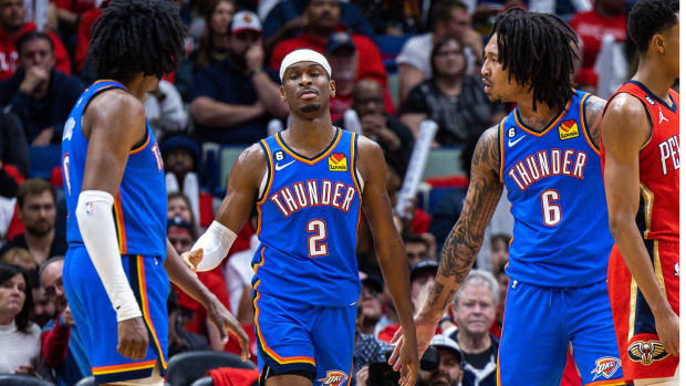 Oklahoma City Thunder guard Shai Gilgeous-Alexander is congratulated by forward Jalen Williams and forward Jaylin Williams.
